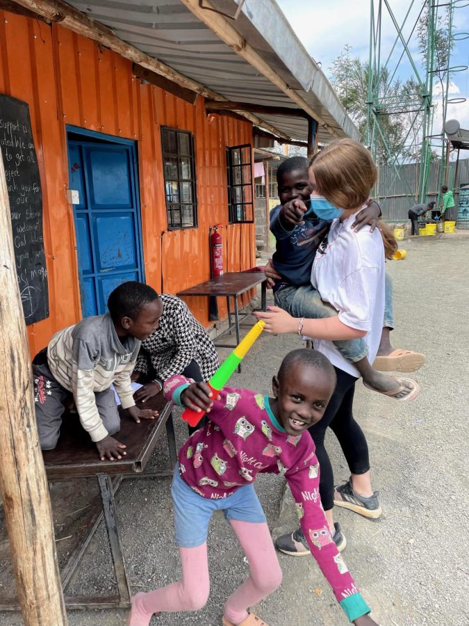 Sophmore Dalya Brickman spends time with children in Kenya. 