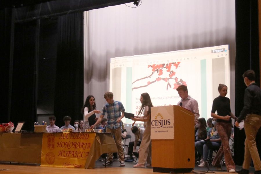 Students accept their awards during the ceremony. 