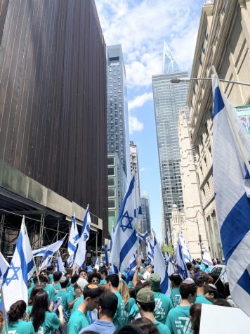Hundreds of supporters from the Bnei Akiva youth-group gather on 5th Avenue for the annual Israel Day Parade.