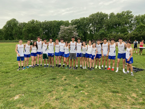 The middle and high school track team celebrates after a meet. 