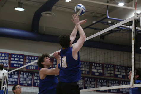 Junior Ben Bass goes up for a spike during a 3-0 loss against the Bishop O’Connell Knights Thursday, May 12. The game was the last of the season, leaving the Lions with a record of 8-5. 
