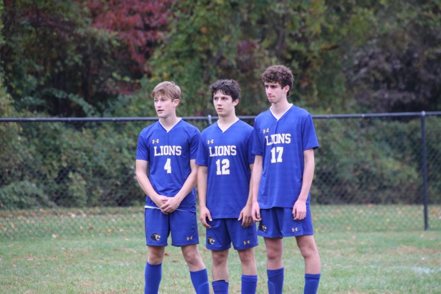 Seniors Jonah Gross, Jared Goldberg and Ari Platt form a wall together in their win against the Barrie School.