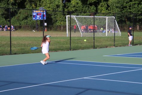 Eighth-grader Gillian Krauthamer hits the tennis ball during her singles match. With their win over the Washington International School on Thursday, October 6, the Lions extended their undefeated record against PVAC teams.