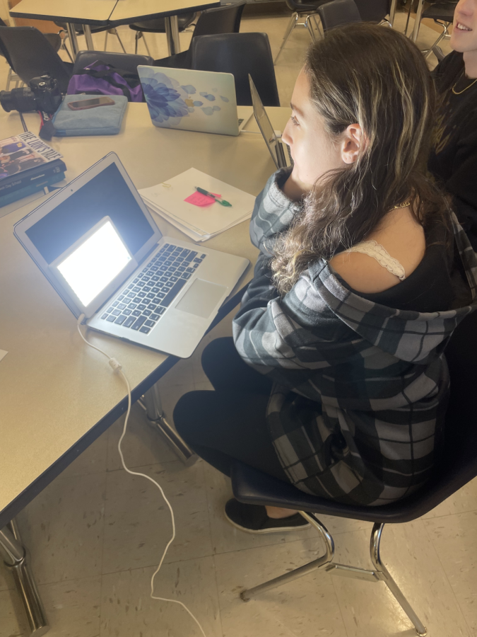 Junior Netanya Shaffin sits in front of a box light meant to treat Seasonal affective disorder