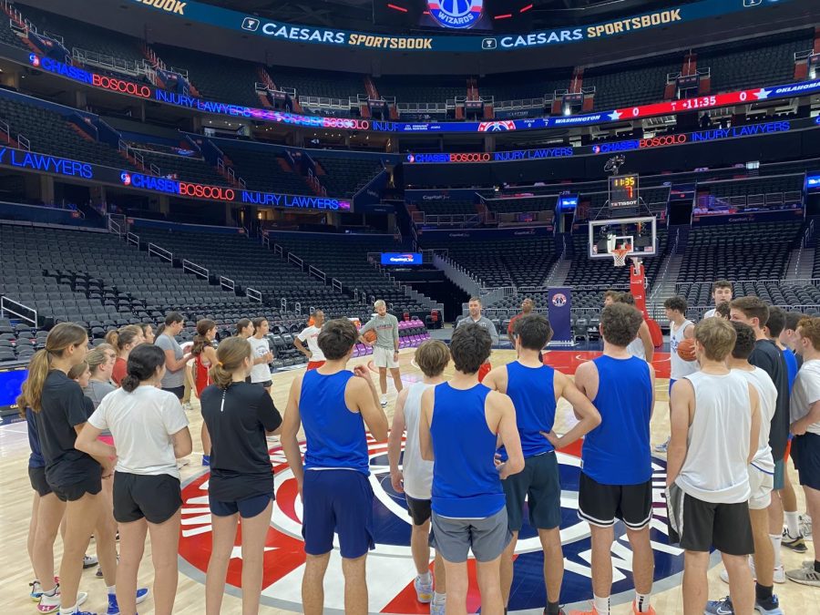 Both the girls and boys varsity basketball teams participate in a practice on the Washington Wizards home court. 