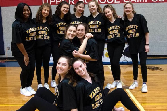 Dance team head coach Melanie Barber with the 2019-2020 dance team. 