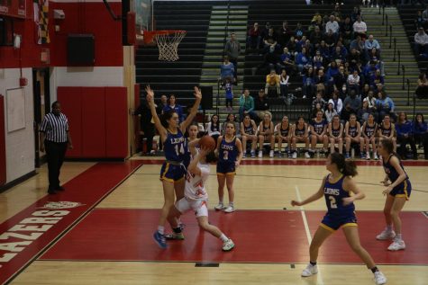 Senior Talia Sporkin goes up for a block in the first half of the PVAC championship.