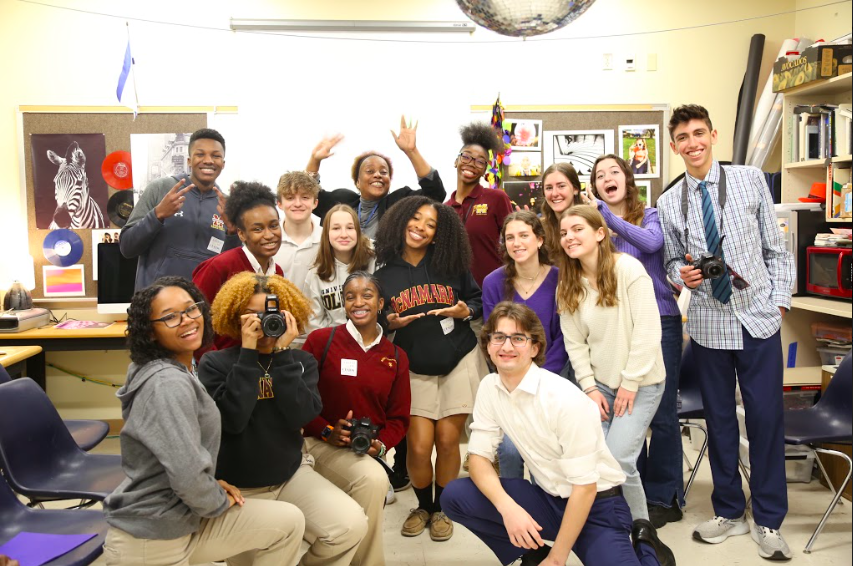 Students from Bishop McNamara accompany JDS students to their photography class.
