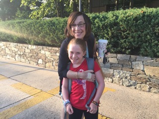 Evonne Schnitzer and granddaughter Ruby greet each other on the first day of school.