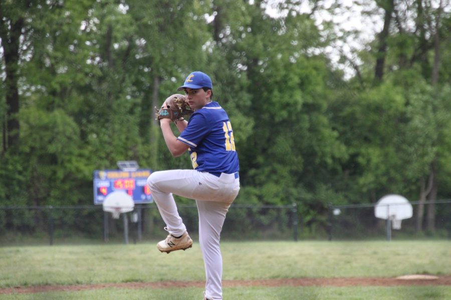 Sophomore and starting pitcher William Zimmet winds up to pitch at the beginning of the game.

Photo by Jordan Levy