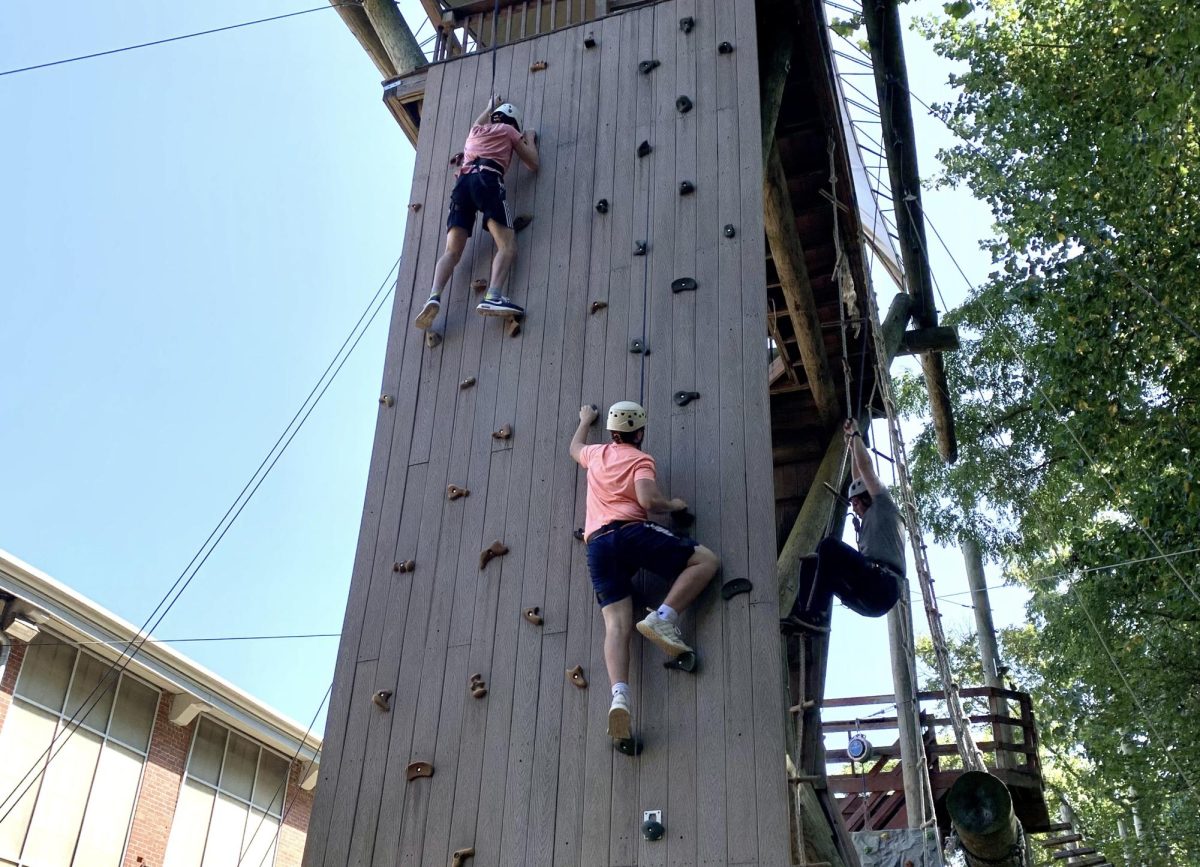 Sophomore students attempt the climbing wall at Terrapin Adventures. 