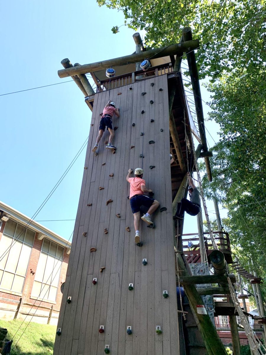 Sophomore students attempt the climbing wall at Terrapin Adventures. 