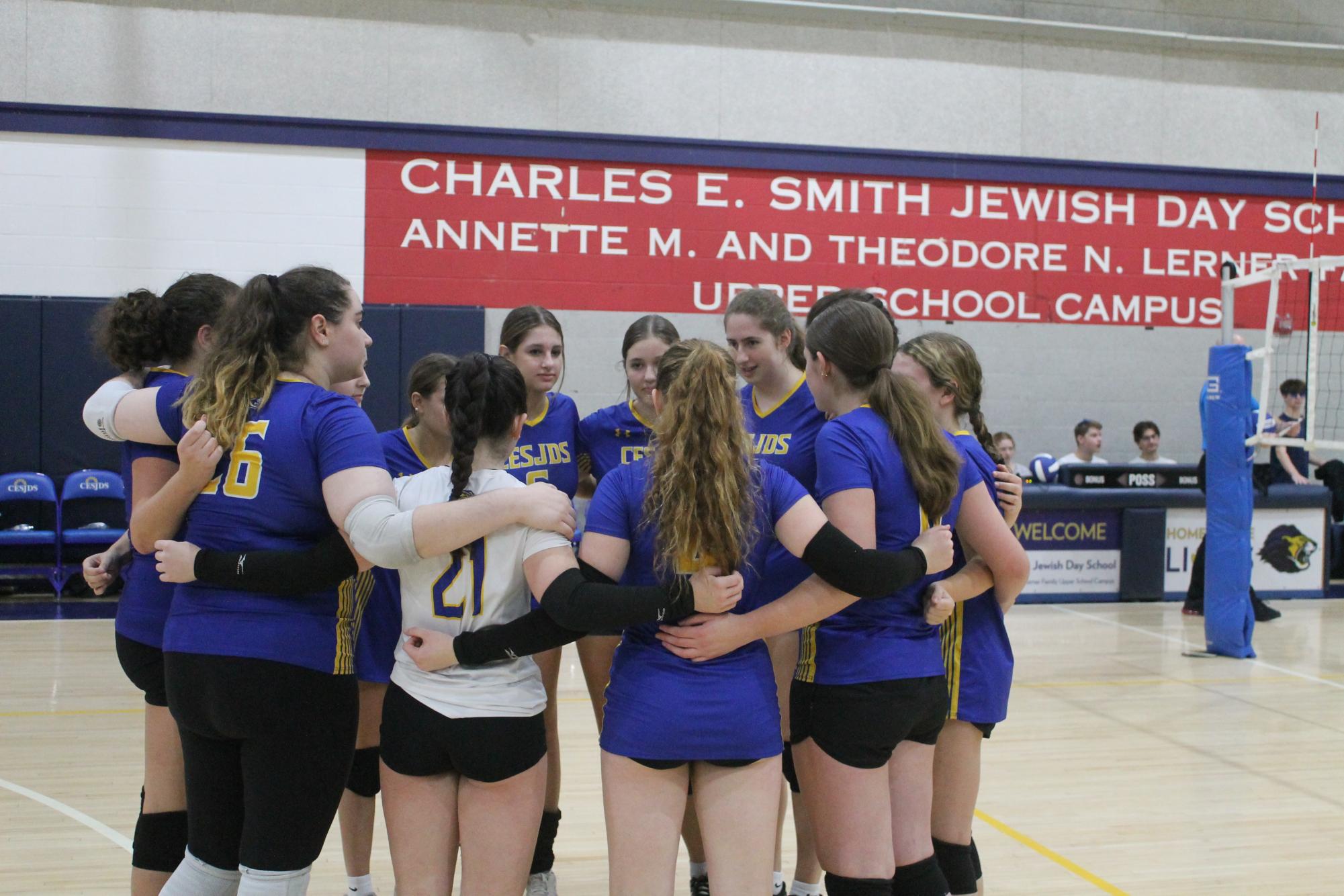 The team huddles before the match, going over their game plan. 