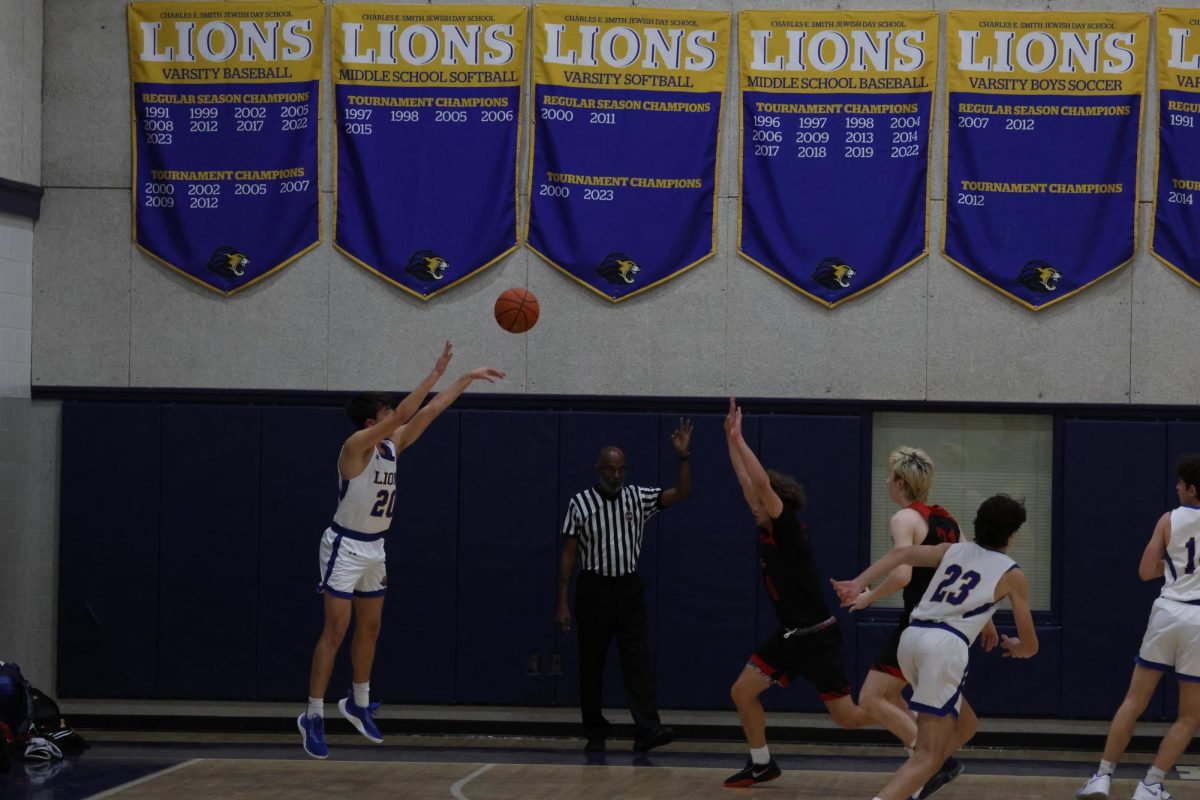 AIMING+HIGH+With+six+points+in+the+game+against+the+Washington+Waldorf+school%2C+senior+Ari+Blumenthal+was+one+of+eight+seniors+who+played+a+large+role+in+helping+the+Lions+secure+a+48-26+victory+Monday+evening.+As+one+of+their+last+home+games+of+the+season%2C+the+seniors+celebrated+their+senior+night+with+a+win.+%E2%80%9C%5BIt%E2%80%99s%5D+so+nice+to+have+a+community+within+the+community%2C+including+through+COVID%2C+because+they+did+play+mostly+through+COVID%2C+which+was+really+amazing%2C%E2%80%9D+Jenn+Blumenthal%2C+the+mother+of+Ari+Blumenthal+said.+%E2%80%9CHes+been+through+two+different+coaches+with+very+different+styles%2C+which+is+really+interesting+to+watch.+And+everyones+grown+together%2C+which+is+also+special.%E2%80%9D