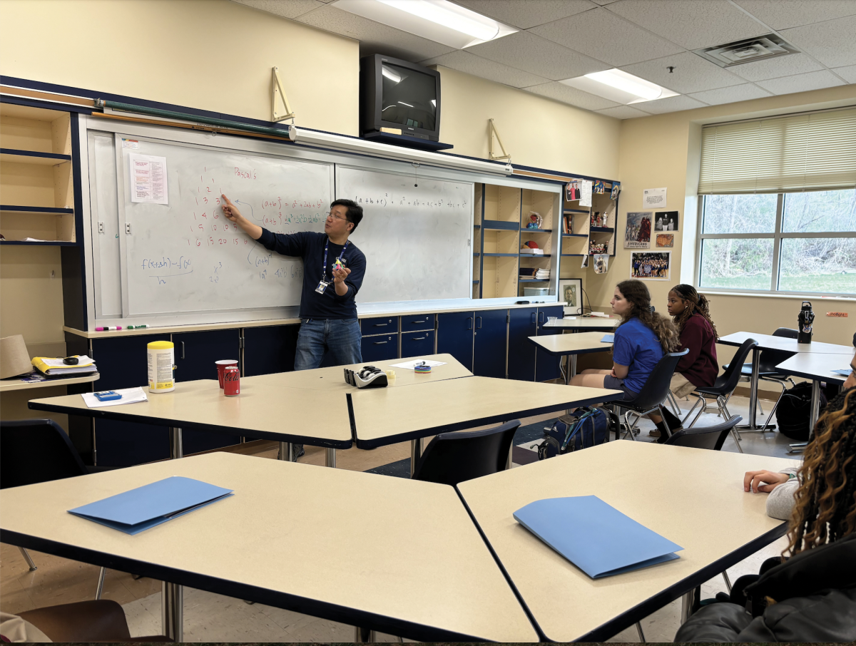 High school math teacher John Watkins- Chow teaches students about the Sierpinski triangle with a hands-on method.