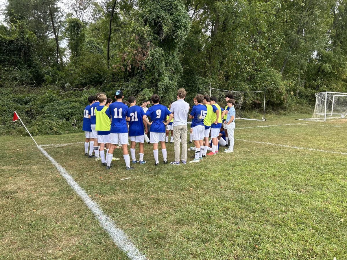 Lions huddle together before starting the second half of their game against Sandy Spring