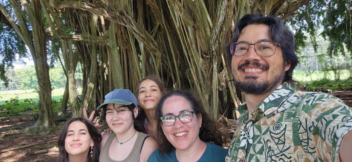 Math teacher and Choir Director Karen Pang smiles for a selfie with her family on a trip to Hawaii over the summer.