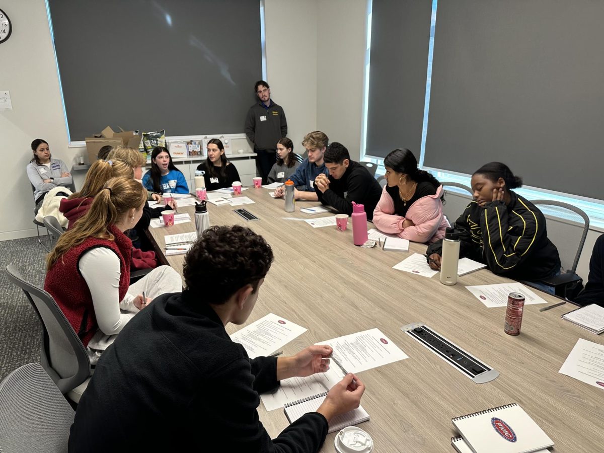 Delegates from the Field School, Mclean School and CESJDS gather at the Field School on Nov. 13 to discuss a code of conduct for the Potomac Valley Athletic Conference (PVAC).