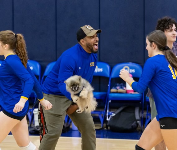 Head coach Juan Alcivar is the first girls varsity volleyball coach in three decades to bring home a championship banner.