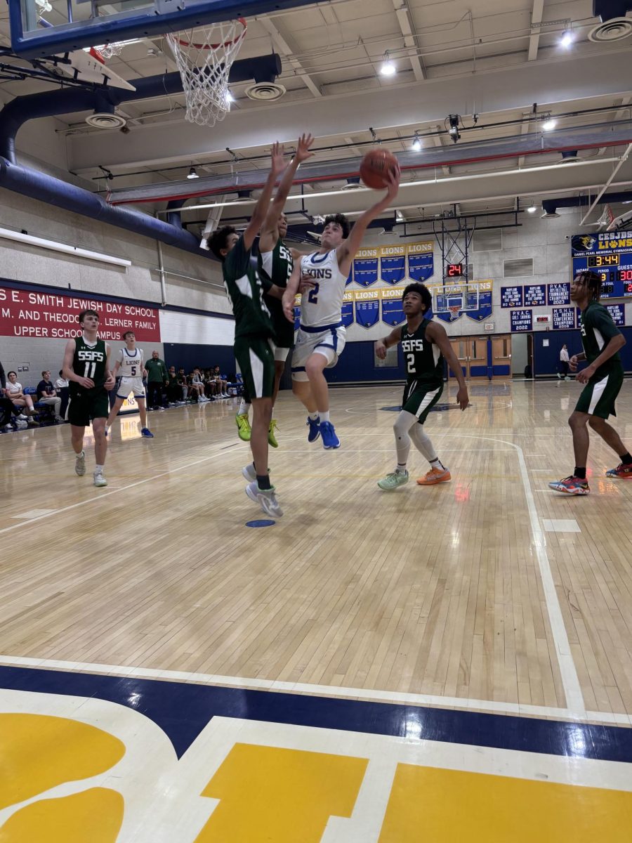 Junior Cyrus Blumenthal goes up for a shot against the Sandy Spring Wildebeests. 