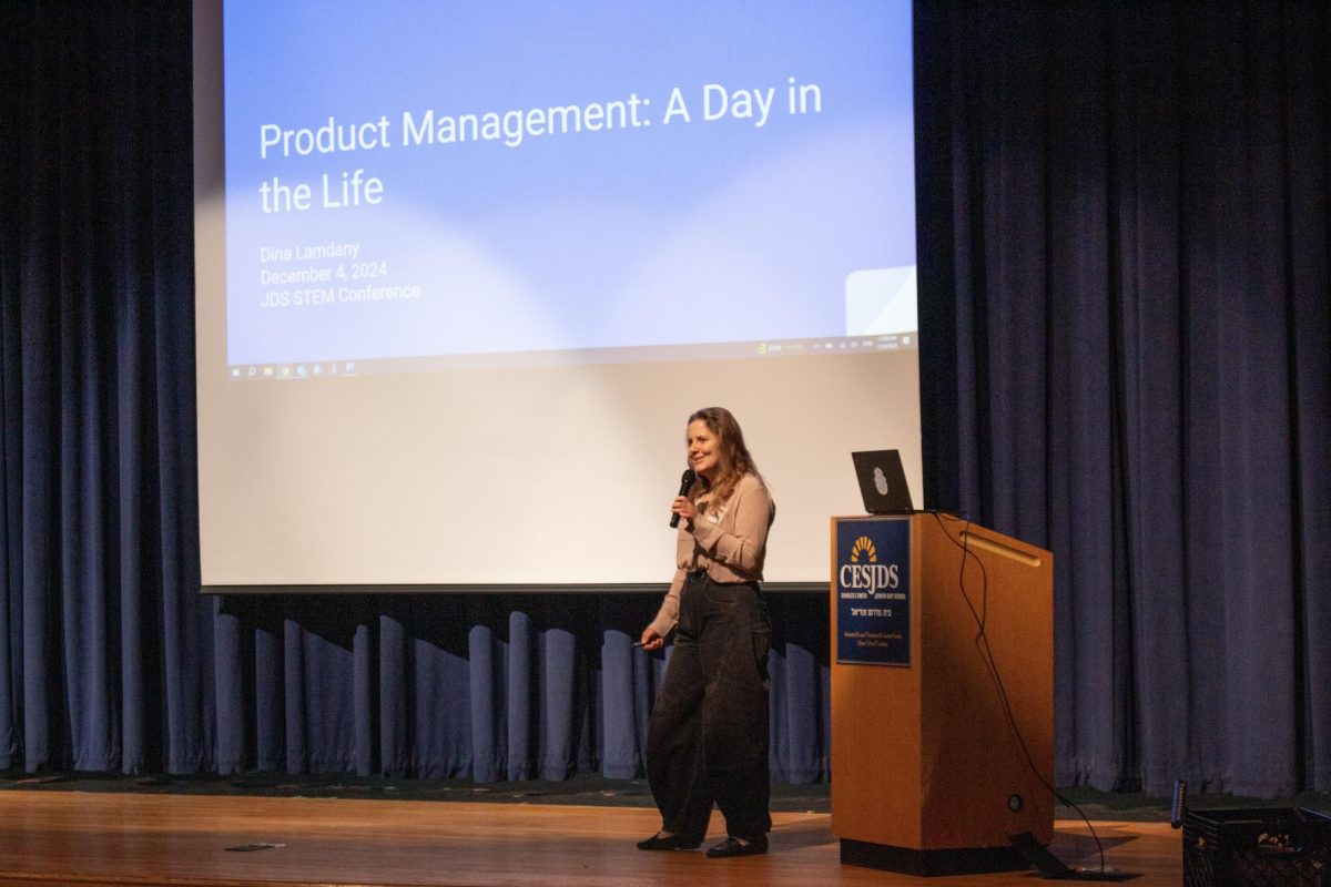 Keynote speaker Dina Lamdany ('11) addresses the high school about her career as a product manager at Roblox on Dec. 4. 