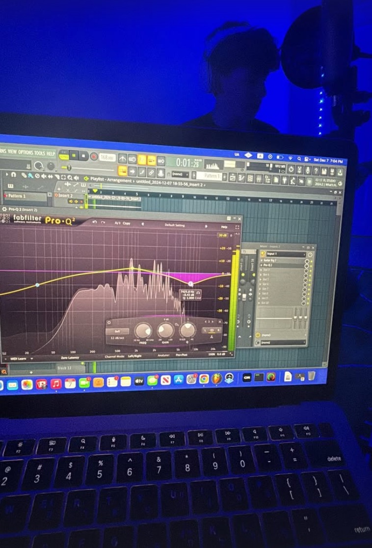 Freshman Jackson Gill plays the guitar for an instrumental as Freshman Hillel Goldberg uses a special software to record. The software is called FabFilterProQ2 and was being used to help regulate frequencies so the guitar had a constant sound.