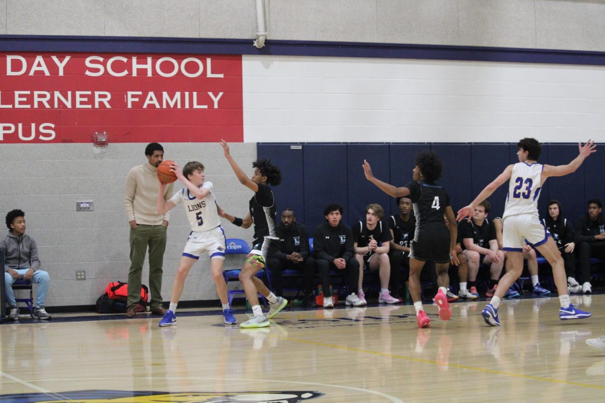 Sophomore Dylan Shank looks to pass the ball in the Lions second game against the Falcons.