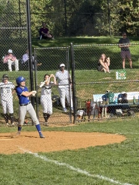 Junior Tali Loeffler hits the ball against the Mustangs on April 23. 