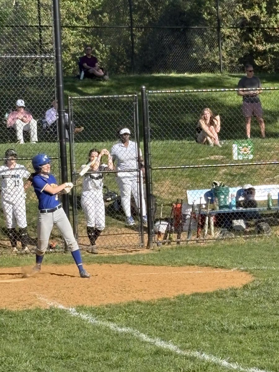 Junior Tali Loeffler hits the ball against the Mustangs on April 23. 