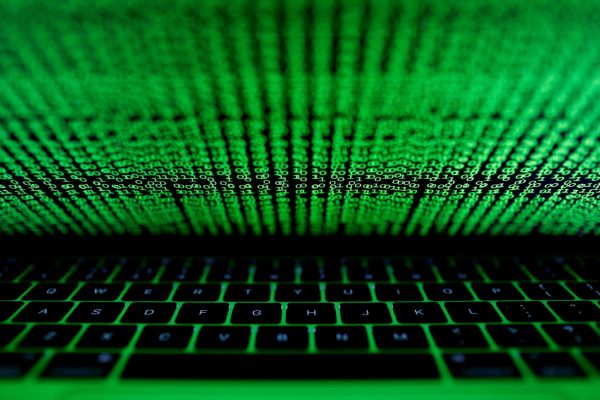 A computer keyboard lit by a displayed cyber code is seen in this illustration picture taken on March 1,  2017. REUTERS/Kacper Pempel/Illustration