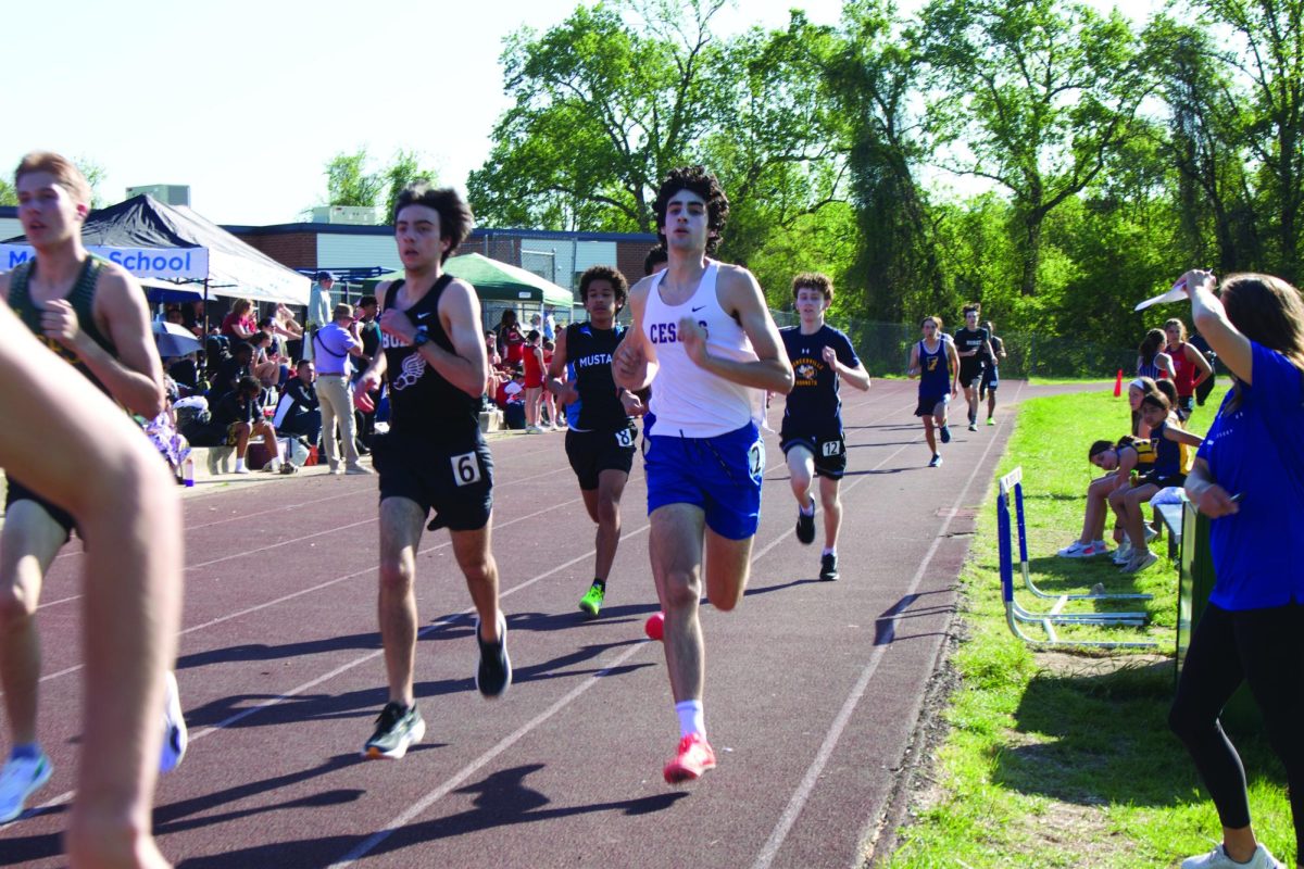 Junior and track co-captain Isaac Yourman races the 800 meter at the Melvin J. Berman Hebrew Academy track. Yourman currently holds the JDS record for the 800 meter race. 