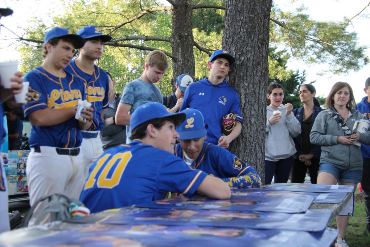 The varsity baseball team held its junior night on Monday, April 28, where they capped off the season with a 3-2 victory over the Melvin J. Berman Hebrew Academy Cougars. Junior Ari Einhorn was the starting pitcher for the Lions. Scoring in the game came late, with the Cougars scoring the first run of the game in the sixth inning. After a pep talk from head coach Mathew Landy, the Lions rallied to put up three runs in the bottom of the sixth inning, securing the win.

Juniors Jesse Fisher, Ian Liss, Adam Salomon, Caden Mont, Matty Stillman and Einhorn were all honored during and after the game with personalized posters and speeches given by Landy. In the speeches, Landy highlighted the juniors’ best moments and how they had grown as individuals and matured over their high school careers. Stillman has played baseball throughout his middle and high school years at JDS, and seeing previous juniors on their junior nights made him cherish Monday even more.

“It was a really awesome experience, and looking back at the two years I've played and seeing the other juniors on junior night and how much it meant to them made it really special for me,” Stillman said. “It would always make me really happy to see how happy they were on the night that was meant for them. That made me really look forward to my junior night, and this year's junior night did not disappoint.”