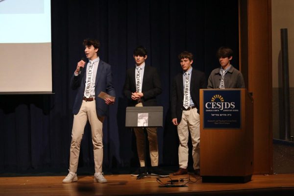 Senior Yedidya Milner-Gillers and juniors Leo Steindecker, Coby Schlactus and Daniel Jacobson present their idea at "Shark Tank" style competition.