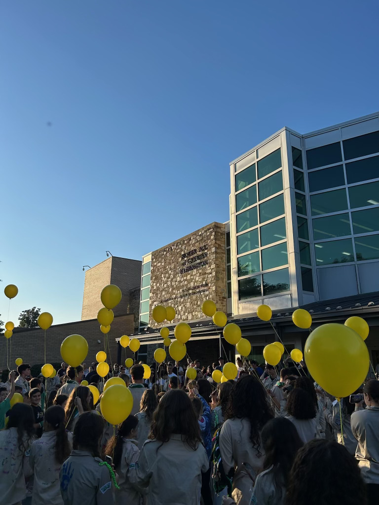 Tzofim participate in a one year memorial of Oct. 7. They shared stories and experiences, and each received a yellow balloon to release outside. 