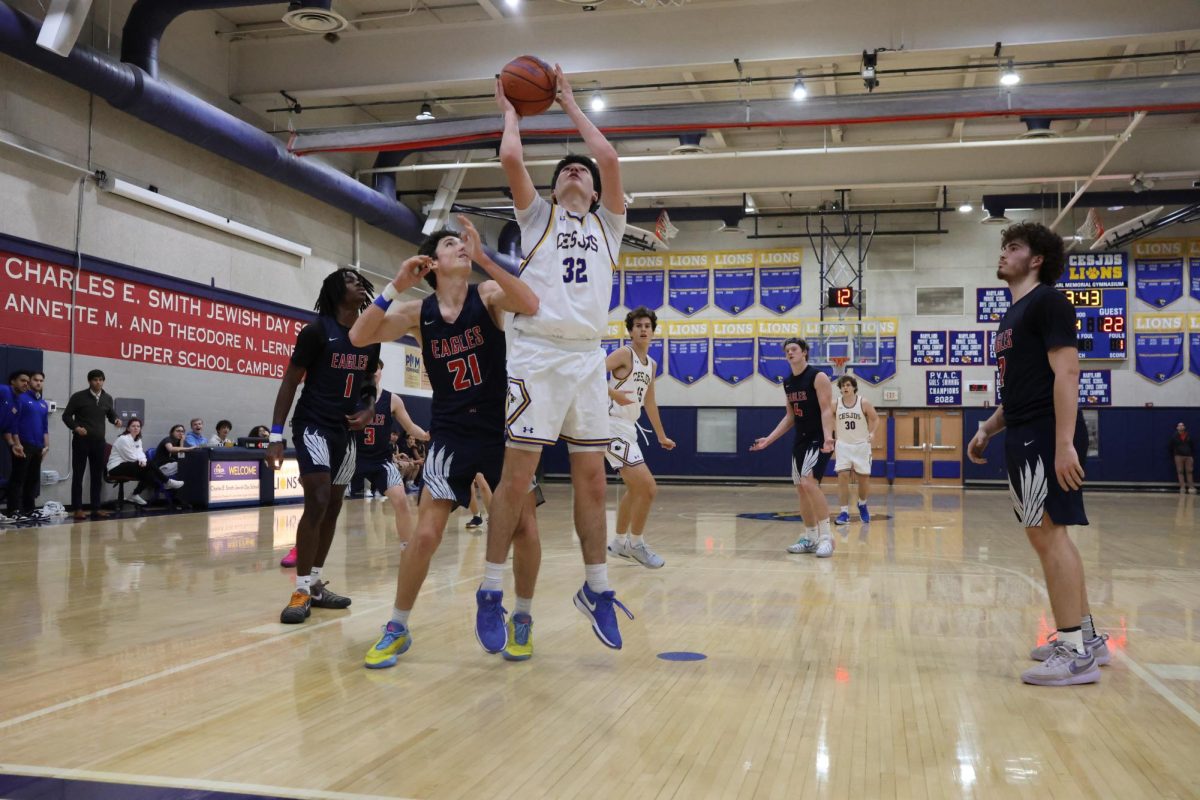 Junior Shia Messler puts up a shot against the Eagles.