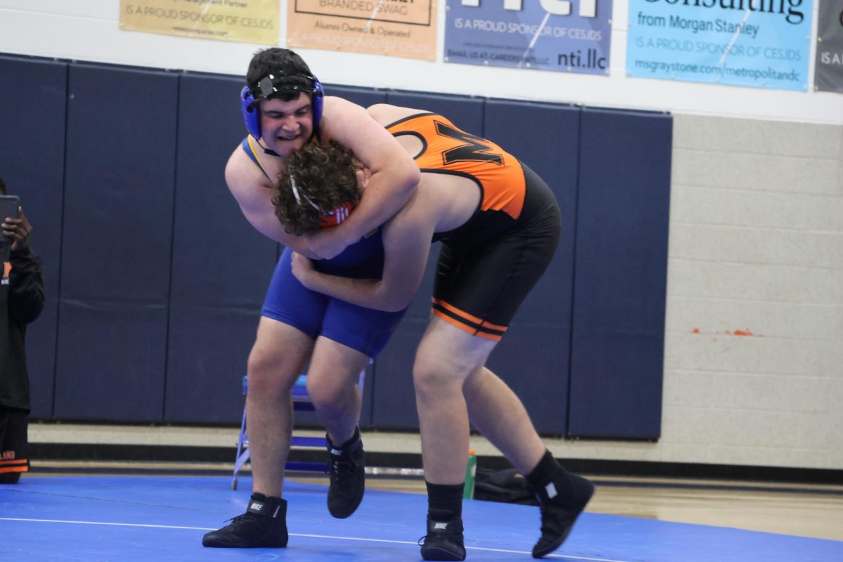 Freshman Ryan Bogdansky wrestles against Model in their match on Nov. 18. 