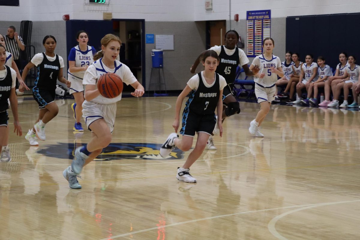 The Lions dribble up the ball in their game against McLean on Dec. 2. 