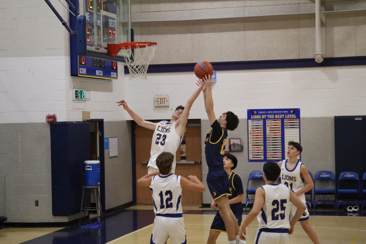 Freshman Ethan Rabinovitch shoots a layup. 