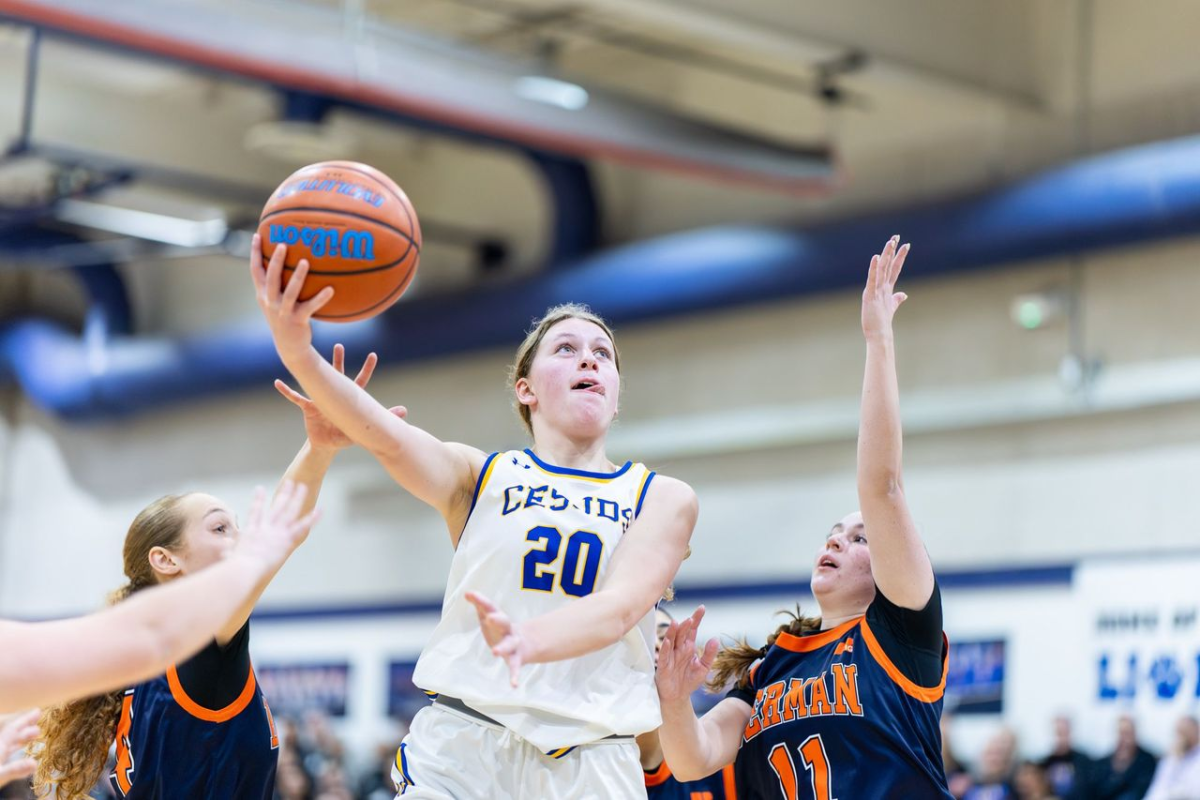 Junior Jordana Dauber scores over her defender during the first Berman game of the season.