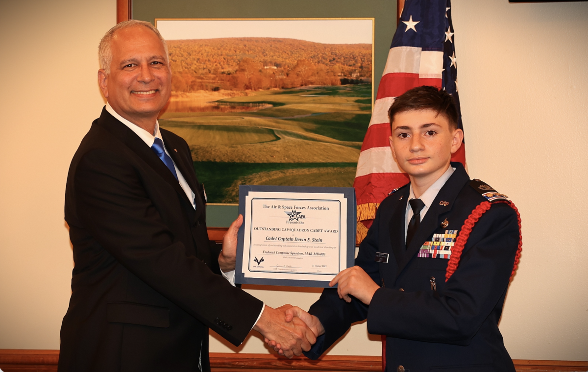Devin Stein is awarded his Outstanding CAP Squadron Cadet certificate.