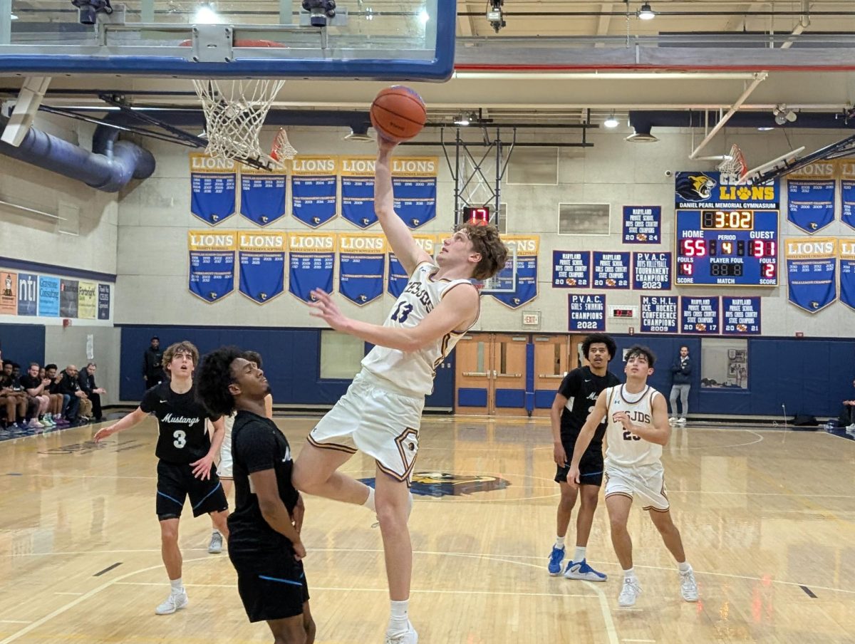 Senior Jakob Lipsky goes up for a layup against the McLean Mustangs. 