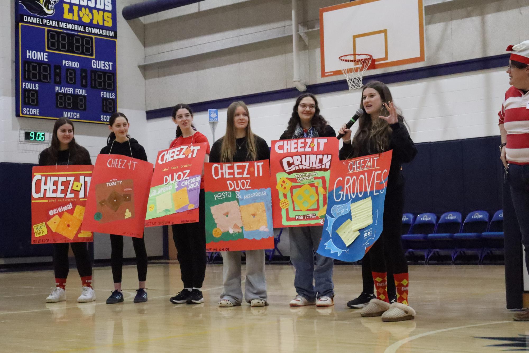 Sophomores Megan Poretsky, Hannah Jakabovics, Allison Fellner, Abby Feffer, Selma Teichman, Liat Netter and Jocelyn Fisher wear homemade Cheez It posters as their costumes.