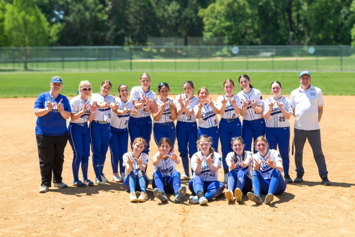 The JDS varsity softball team celebrates winning the PVAC for the fourth consecutive year after defeating Model on May 10.