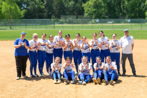 The JDS varsity softball team celebrates winning the PVAC for the fourth consecutive year after defeating Model on May 10.