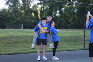 Just after receiving their senior jerseys, junior Mayaan Horwitz (right) poses with juniors Micah Brickman (center) and David Schanzer (left). The class of 2027 arrived at school early to pick up their new senior jerseys and enjoy donuts. “It's just a whole grade bonding experience,” Schanzer said. “It was a lot of fun hanging out with friends.”